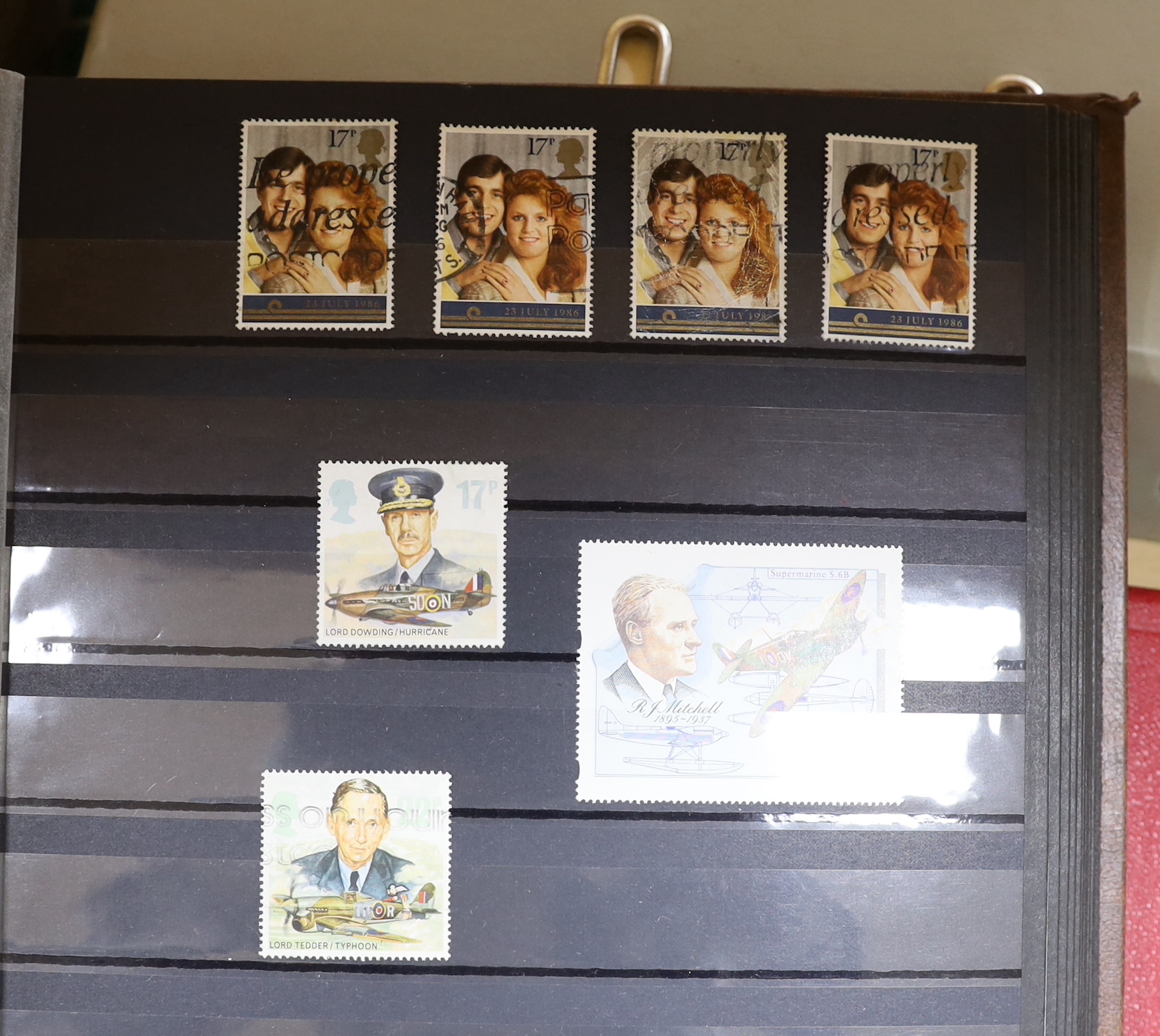 A collection of stamps arranged in albums including Romanian and Indian examples